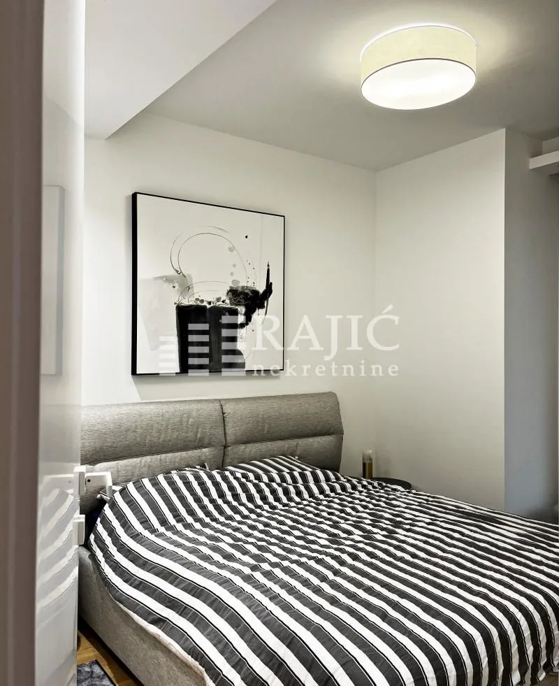 Modern bedroom with a double bed.