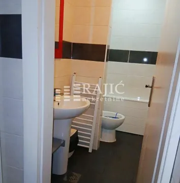 View of the bathroom with a sink and sanitary fixtures. - image 10
