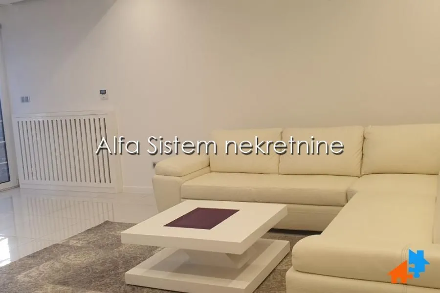 Living room with a corner sofa and a coffee table.