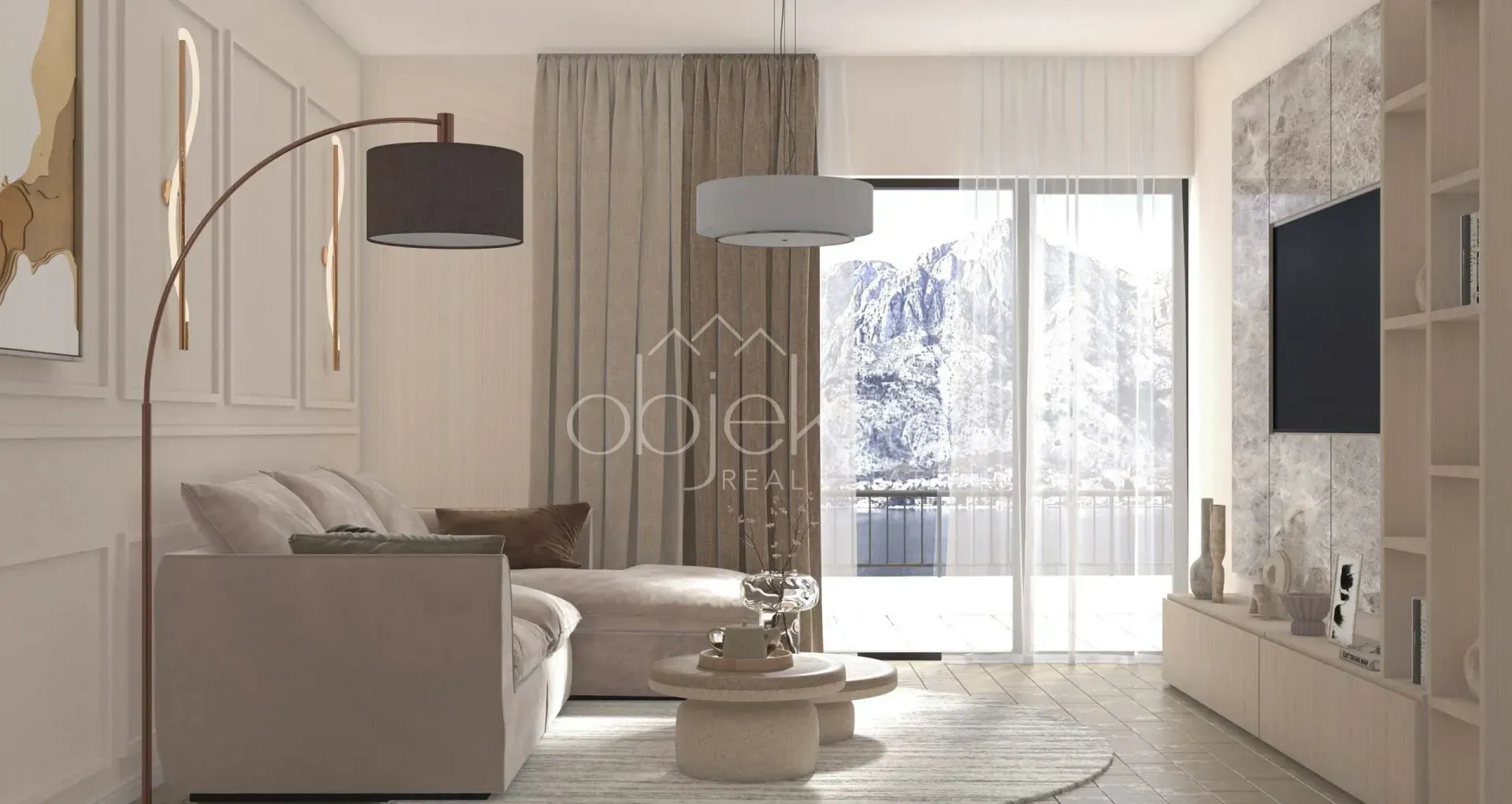 Modern living room with a sofa, TV, and mountain view.