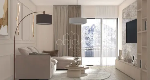 Modern living room with a sofa, TV, and mountain view. - image 5