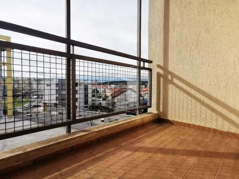 Unfurnished balcony with tiled floor and metal railing. - image 10