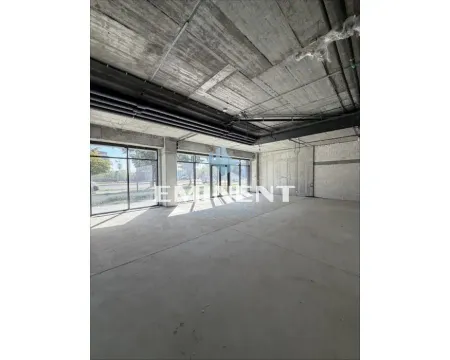 A view of an unfurnished space in rough construction phase with large windows. - image 3