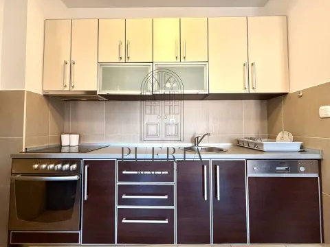 Modern kitchen with dark wood-tone lower cabinets and white upper cabinets. - image 7