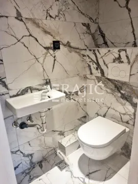 Small bathroom with modern marble tiles, washbasin and toilet bowl. - image 8