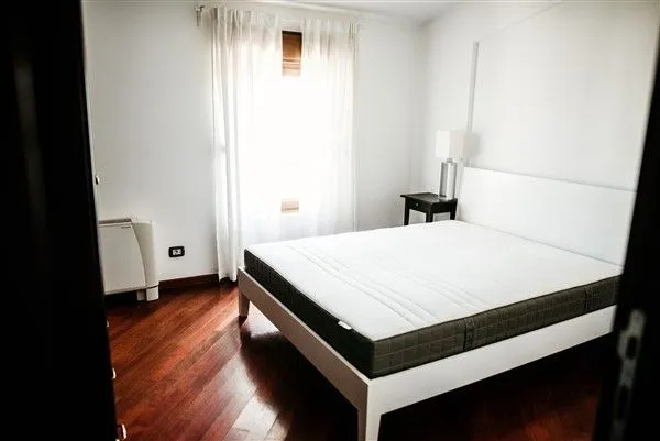 Simple bedroom with a double bed.