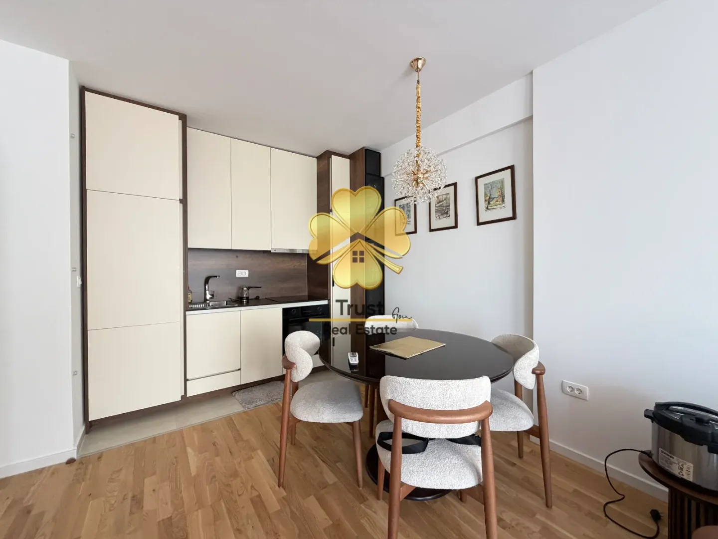 Modern kitchen with dining area and built-in appliances.
