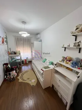 Children's bedroom with a bed, white furniture unit, and toys. - image 3
