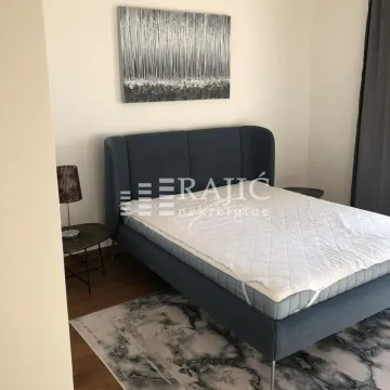Furnished bedroom with a double bed. - image 4