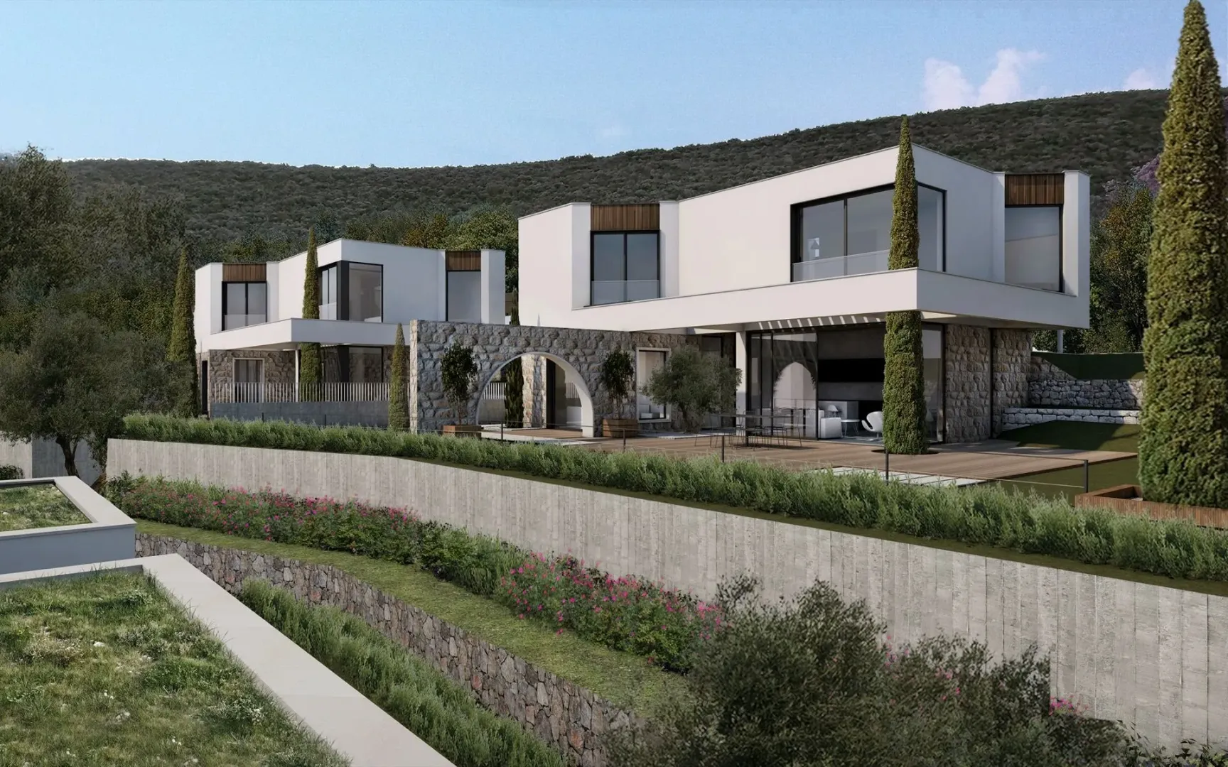 Spoljašnji izgled moderne vile sa terasom i uređenim dvorištem.