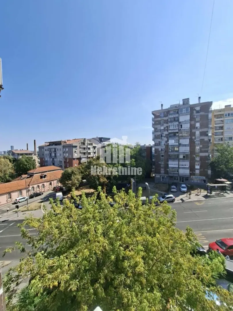 View from the window overlooking surrounding buildings and the street.
