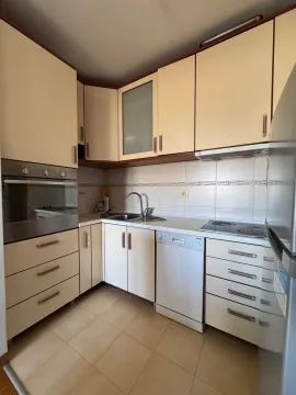 Small kitchen with built-in cabinetry and appliances. - image 4