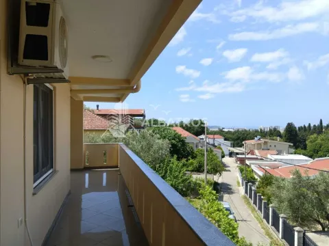 View from the balcony overlooking the surrounding neighborhood and greenery. - image 18