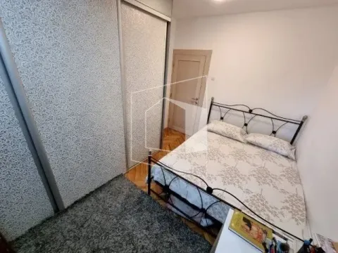 Furnished bedroom with a double bed and built-in wardrobes. - image 11
