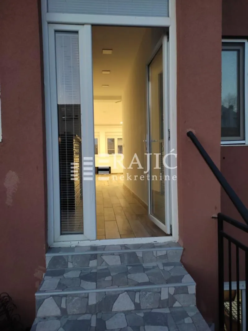 Entrance door and stairs of the building.