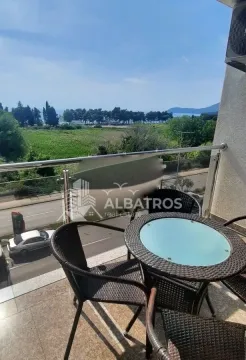 Furnished balcony with a table and chairs and a view of nature and the sea. - image 14
