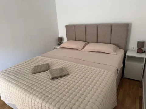 Bedroom with a double bed and bedside tables. - image 14