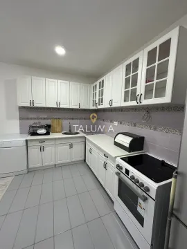 Kitchen with white cabinetry, sink, and stove. - image 7