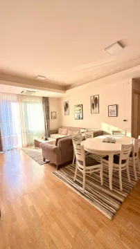 Living room with a sofa set and a dining table. - image 5
