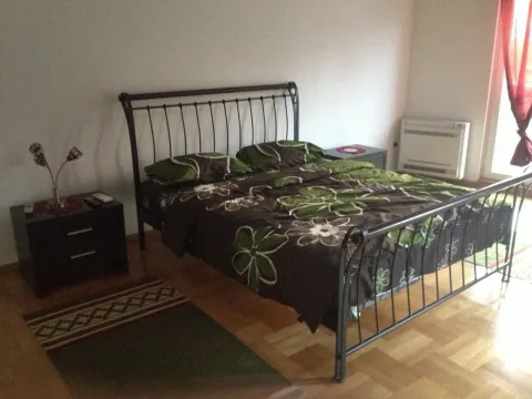 A tidy bedroom with a double bed. - image 8