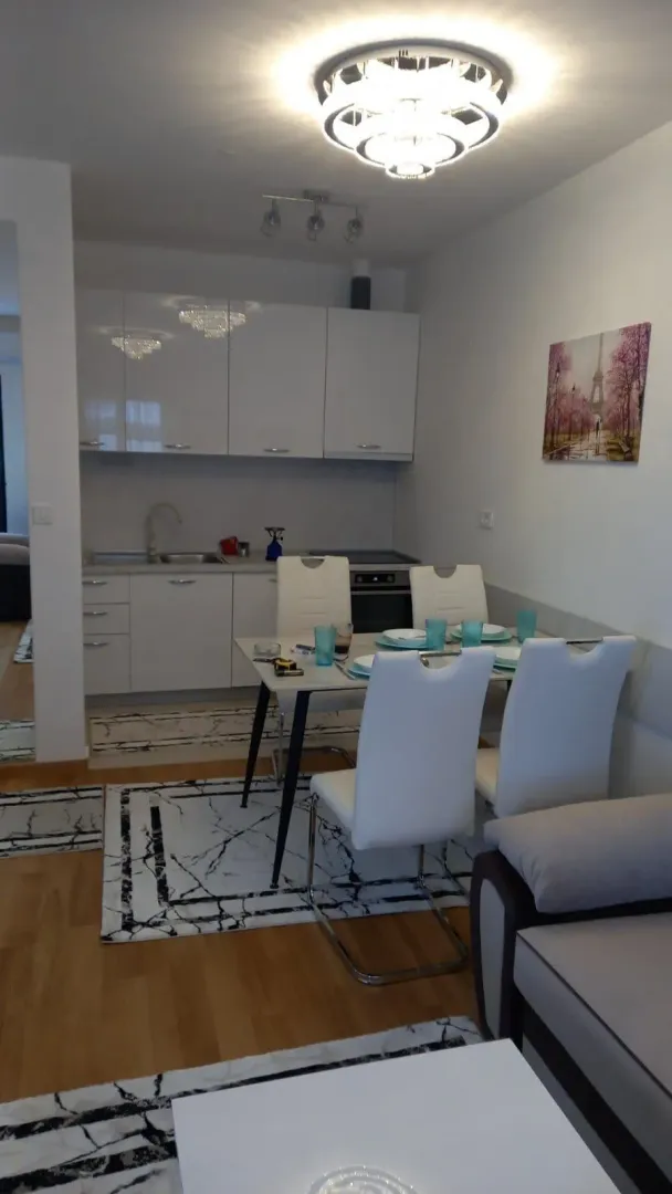 Bright kitchen with a dining table and chairs.
