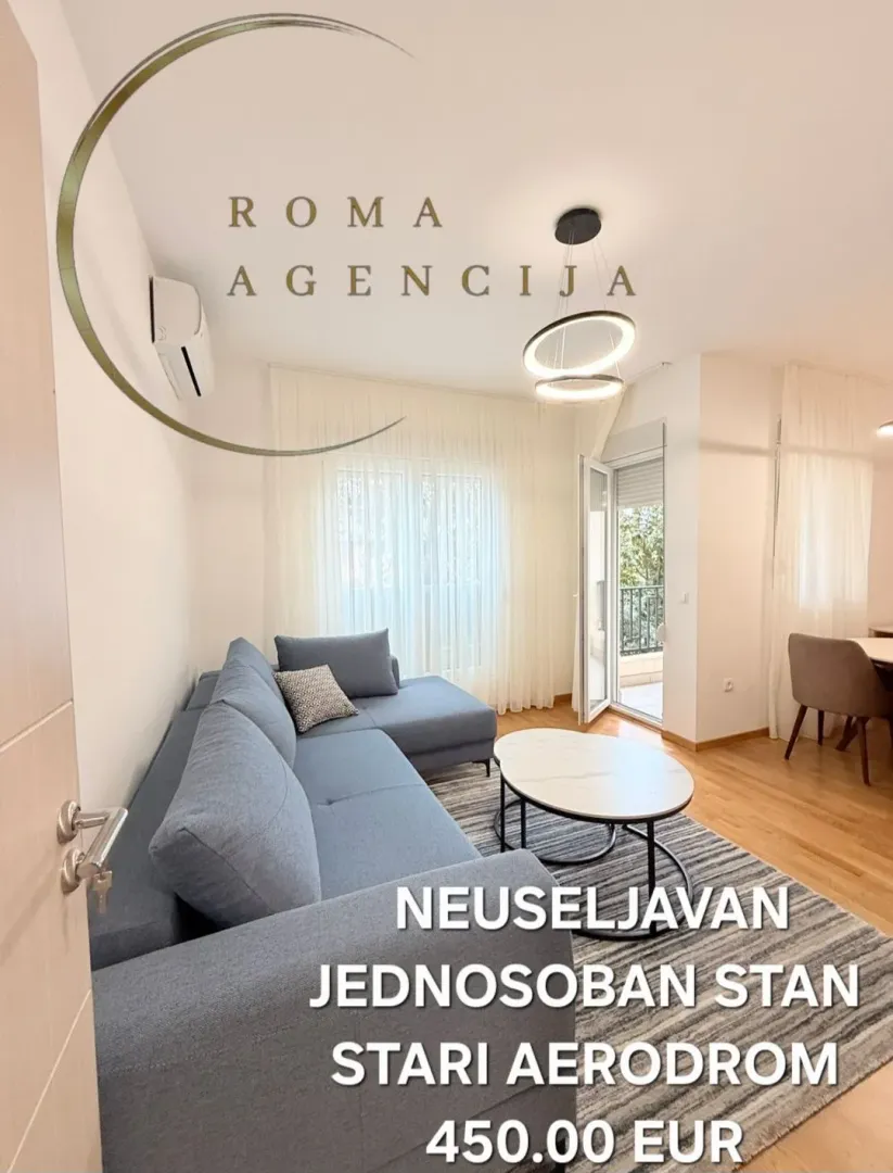 Living room with sofa and dining area.