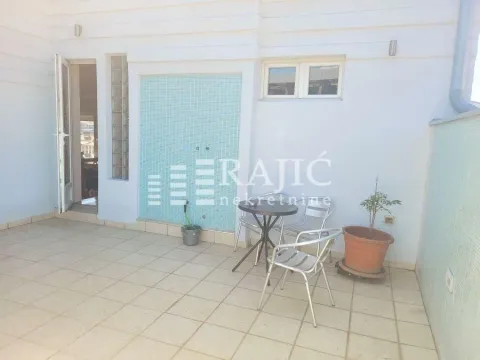 Spacious terrace with patio furniture and tiled flooring. - image 3