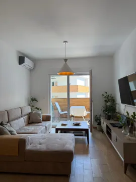 Furnished living room with a sofa and access to the terrace. - image 6