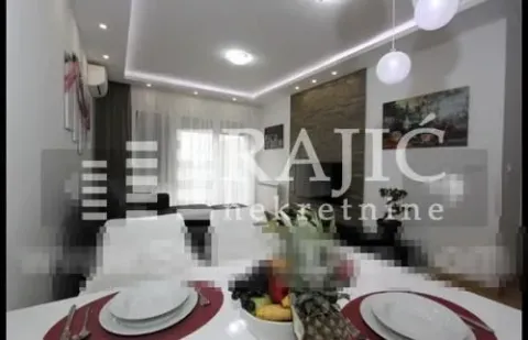 Living room with dining area and modern lighting. - image 3