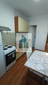 Smaller kitchen with a dining table and kitchen units. - image 6