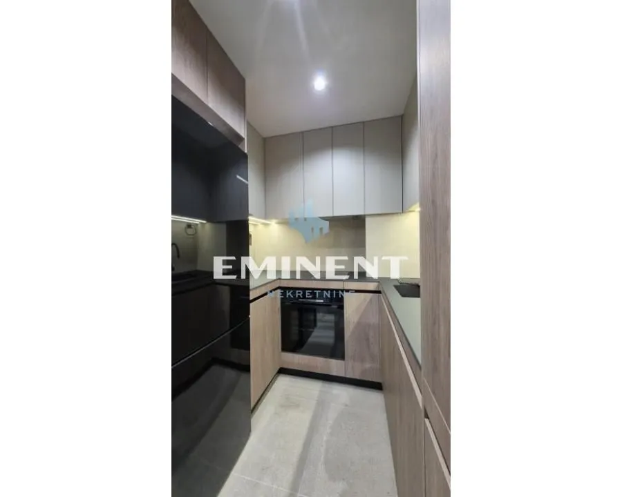 Modern kitchen with built-in cabinetry and appliances.