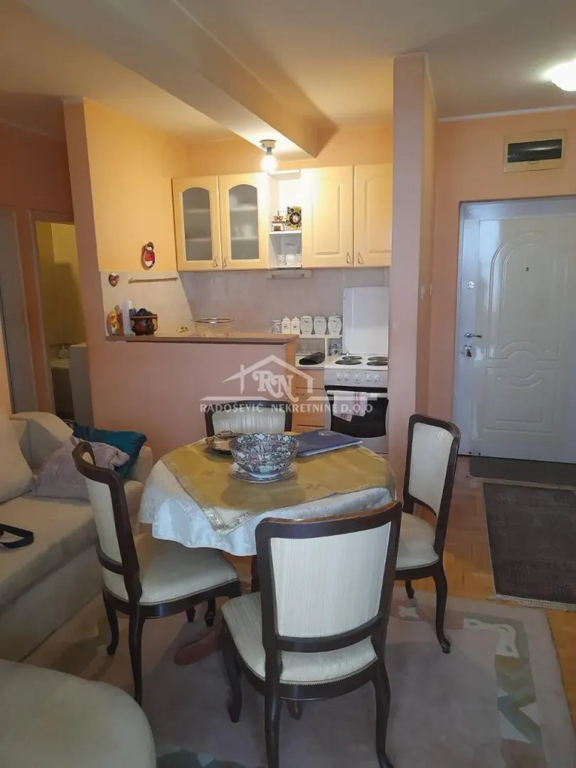 Smaller kitchen connected with the dining area and living room.
