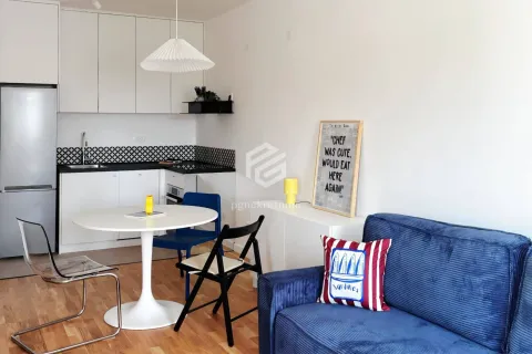 Living room with dining area and kitchen in one space. - image 9