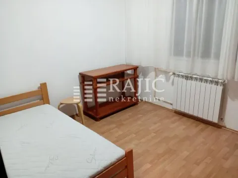 Furnished bedroom with a wooden bed and a dresser. - image 9