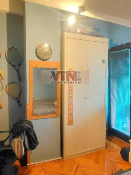 Small bedroom with a wardrobe and wooden flooring. - image 5