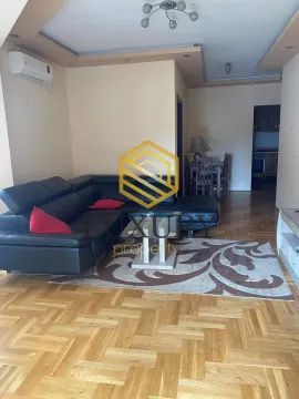 Living room with a sofa set and a dining area in the background. - image 8