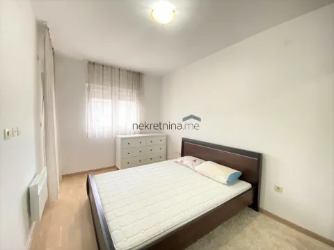 Bright bedroom with a double bed and dresser. - image 7