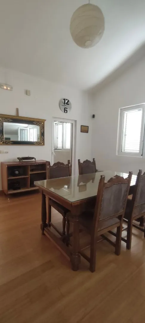 Dining room with a wooden table and chairs.