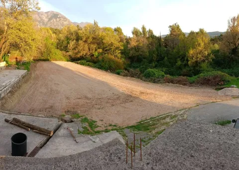Land prepared for construction with a view of the forest and mountains. - image 3