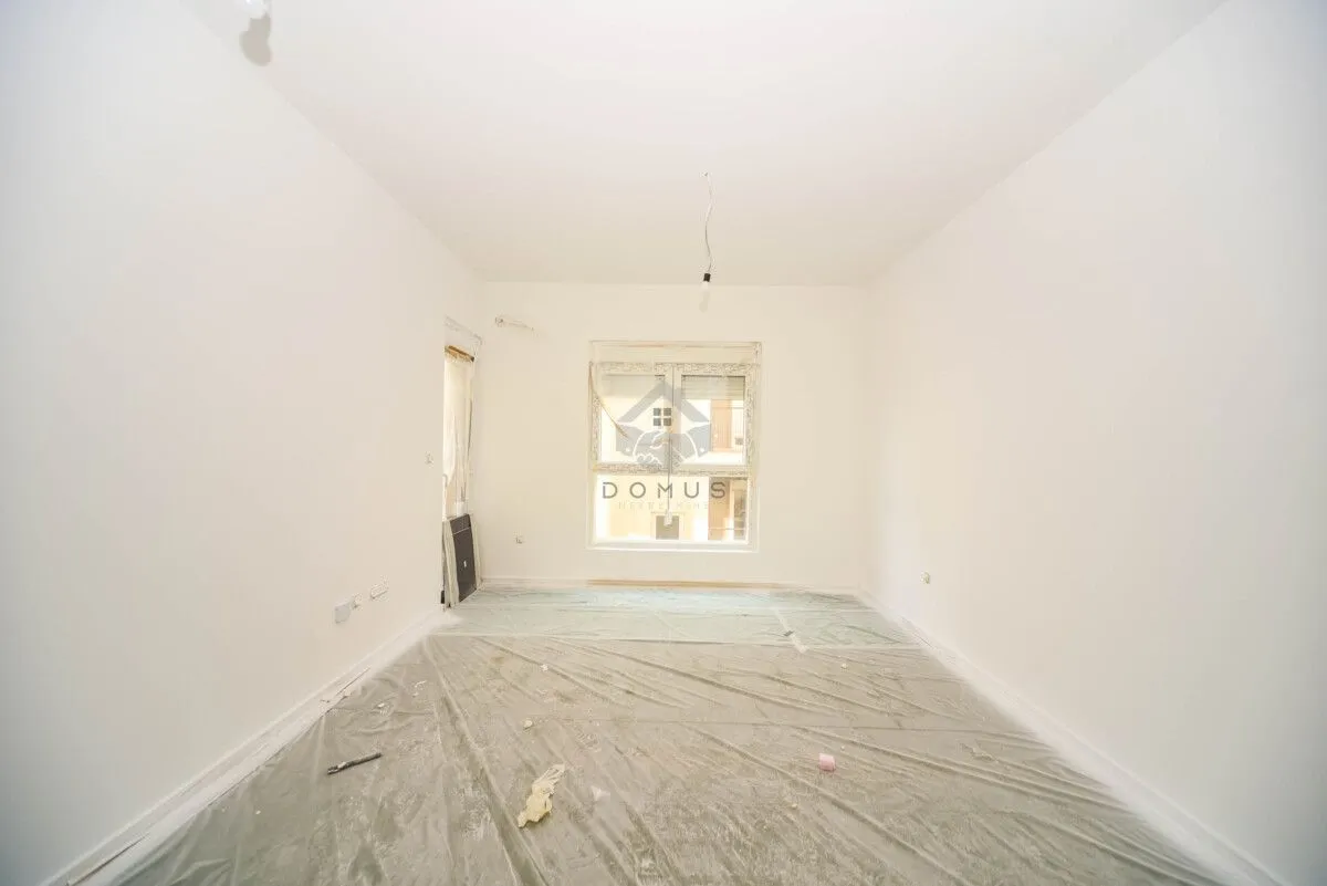 Empty room with white walls during renovation.
