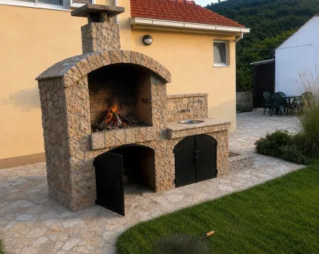 Built-in barbecue in the backyard of a family house. - image 13