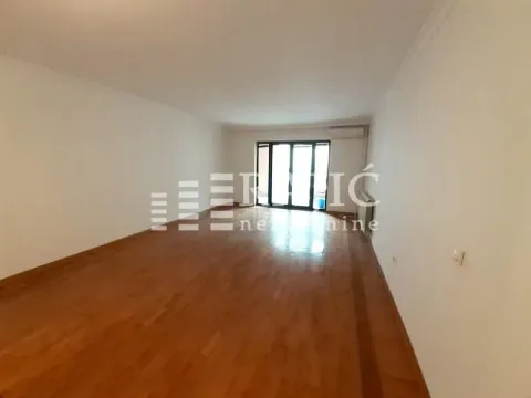Empty spacious room with parquet flooring and terrace access. - image 12