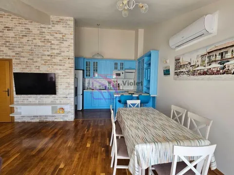 Living room with dining area and an open kitchen in blue. - image 5