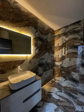 Modern bathroom with a basin and a walk-in shower. - image 15