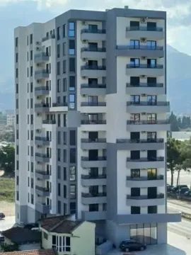 View of a modern multi-story residential building with balconies. - image 2