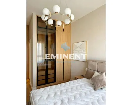 Bedroom with a large double bed and a built-in wardrobe. - image 8