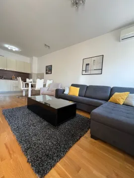 Spacious living room connected to the dining area and kitchen. - image 2