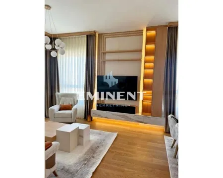 Modern living room with TV and wooden wall panels. - image 2