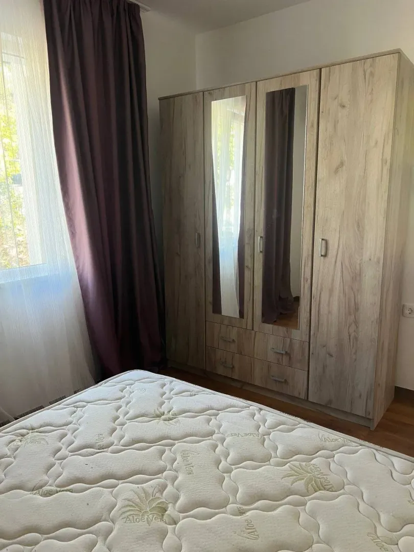 Bedroom with a large wardrobe and a bed.