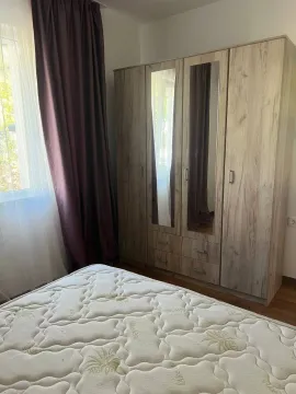 Bedroom with a large wardrobe and a bed. - image 11